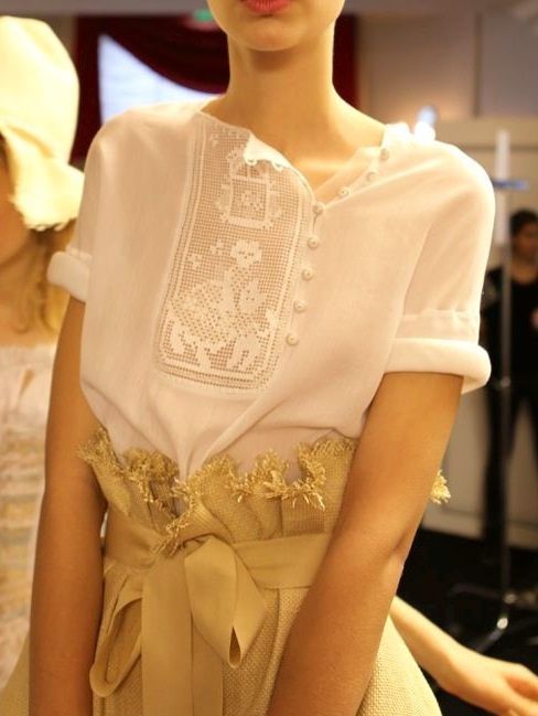 Russian folk-style embroidered blouse. Ulyana Sergeenko, a fashion designer from Moscow.