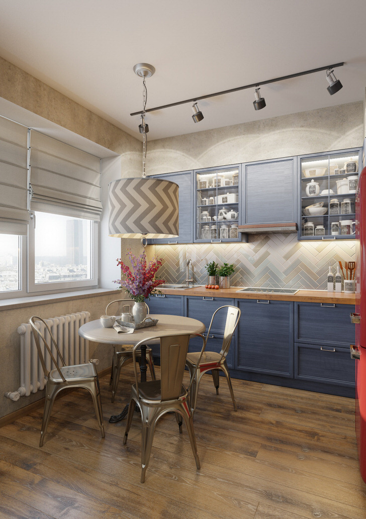 Бледно-синий цвет кухонного гарнитура - отличное решение для кухни в стиле эклектика. Пример отлично подобранного освещения, которое раздельно освещает рабочую зону и обеденный стол.