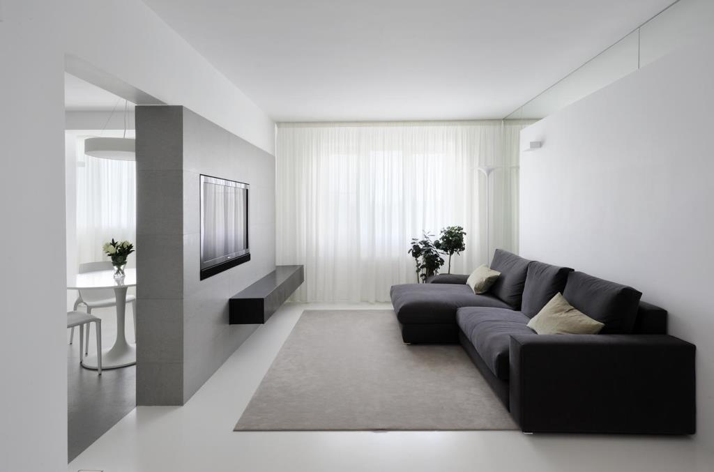 Гостиная, оформленная в стиле минимализм, радует взгляд своей функциональностью и свободным пространством