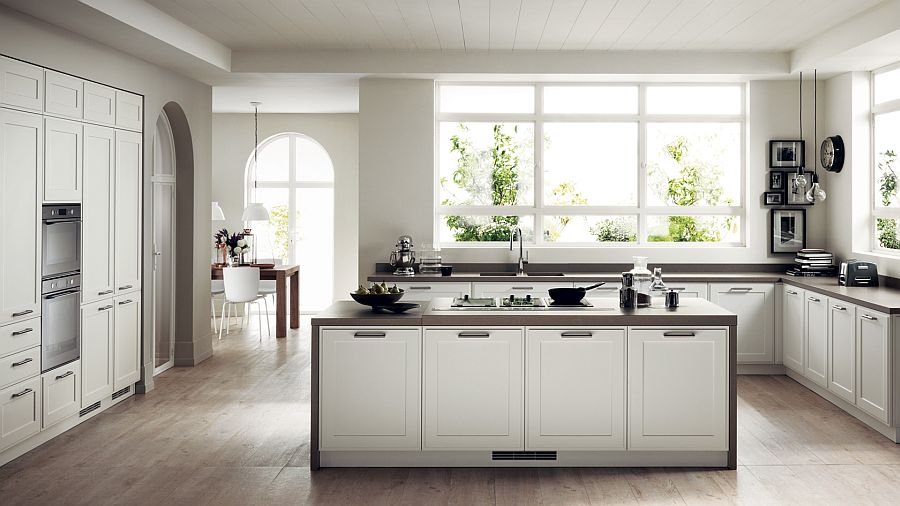 Белый кухонный остров с тёмной столешницей в интерьере кухни