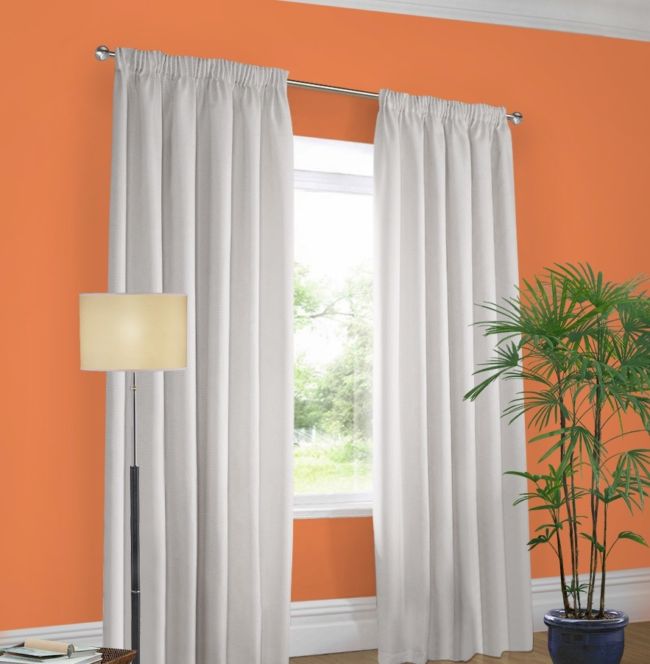 Orange wall white curtains