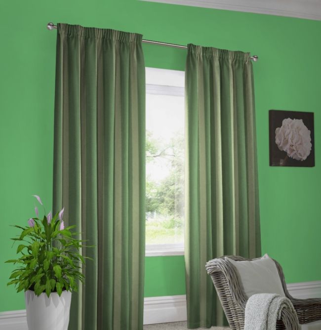 The green walls dark green curtains striped khaki