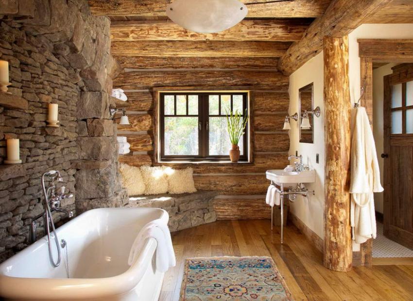 Ванная комната оформлена с применением камня и деревянного сруба