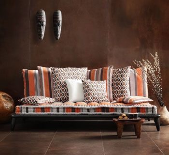 Super fresh, modern African blend in this seating area. Love the patterns.