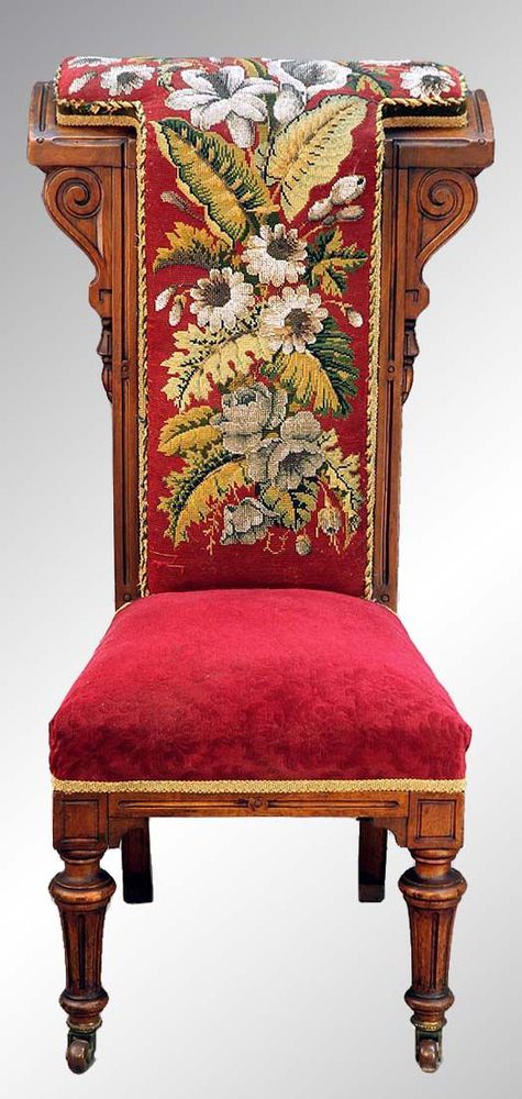 This is a beautiful Victorian needlepoint and crewel work-backed prayer bench with a solid black walnut deep frame dating from the 1880’s.