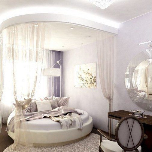 Фото комнаты с круглым ложем, оформленной в пастельных тонах.