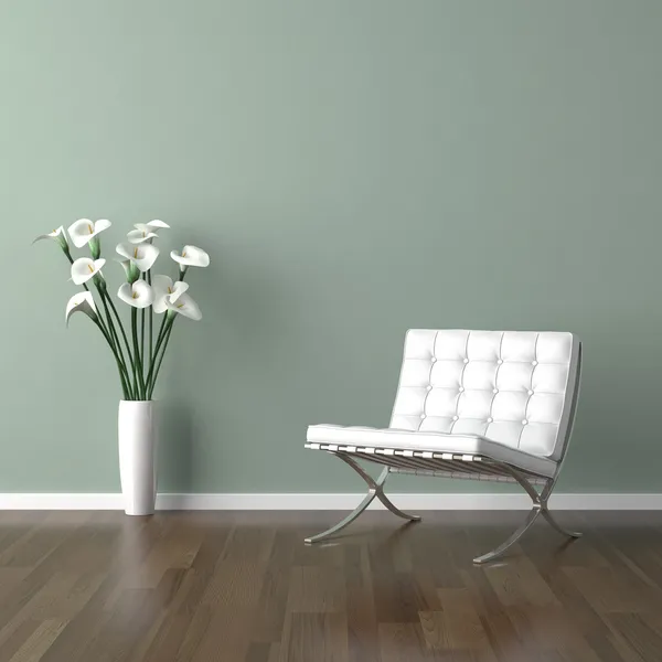 Белый металлический стул с кожаным сиденьем на зеленом — стоковое фото