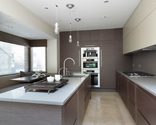 зональное разделение пространства в кухне серого цвета при помощи освещения